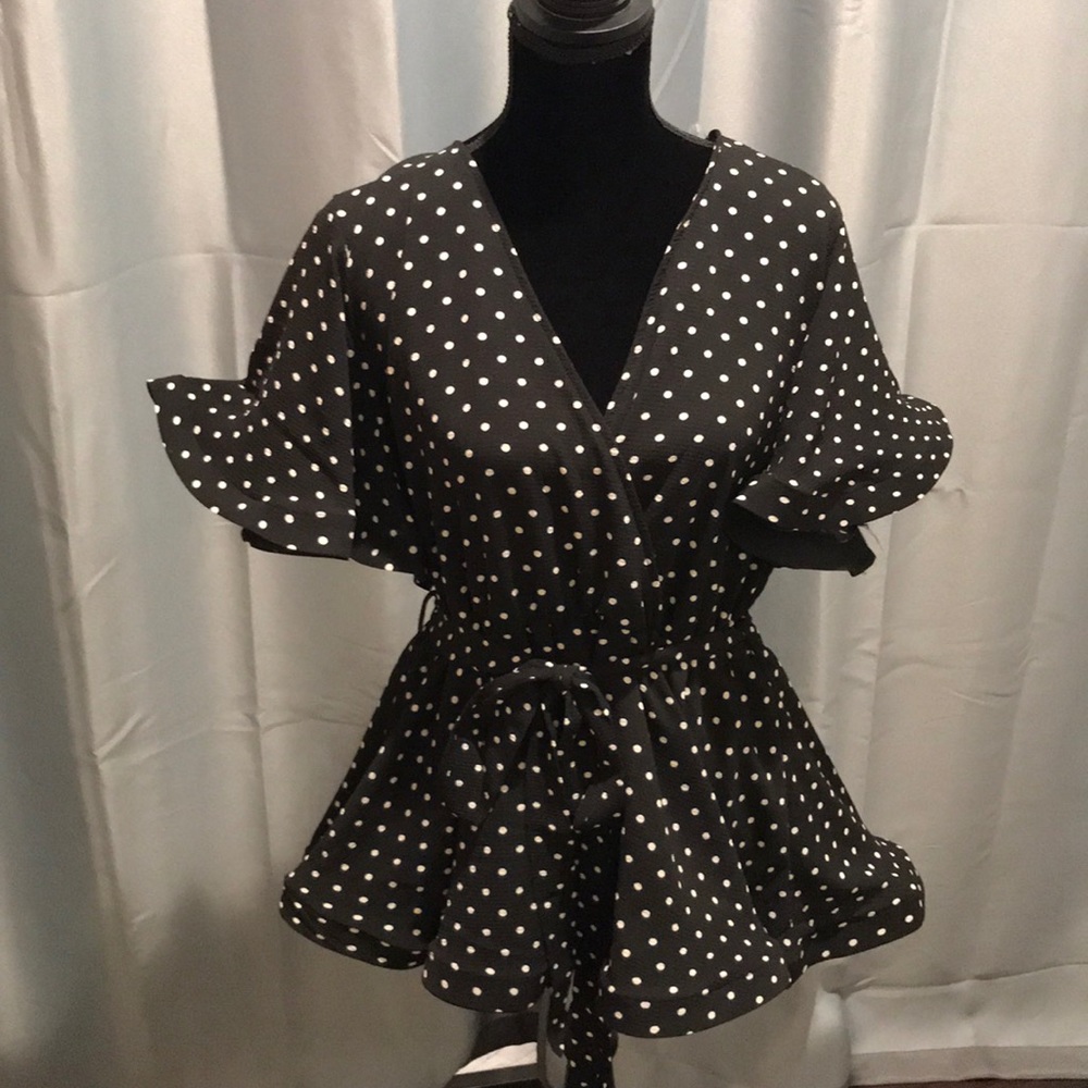 Black and white polka dot mock wrap blouse